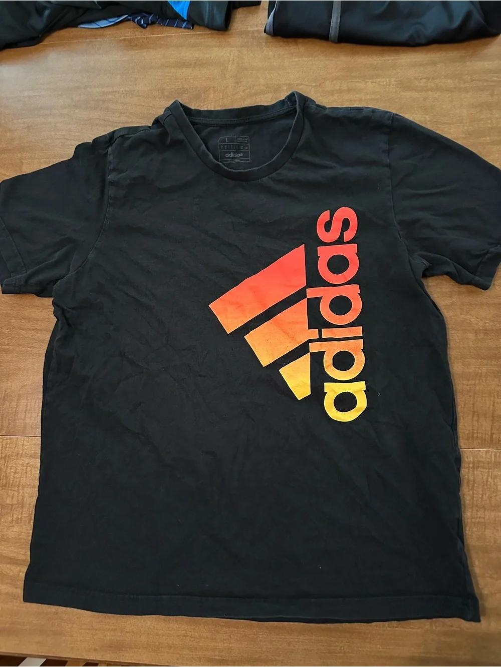 adidas Black Short-Sleeve Tee with Red-Orange-Yellow Gradient Logo